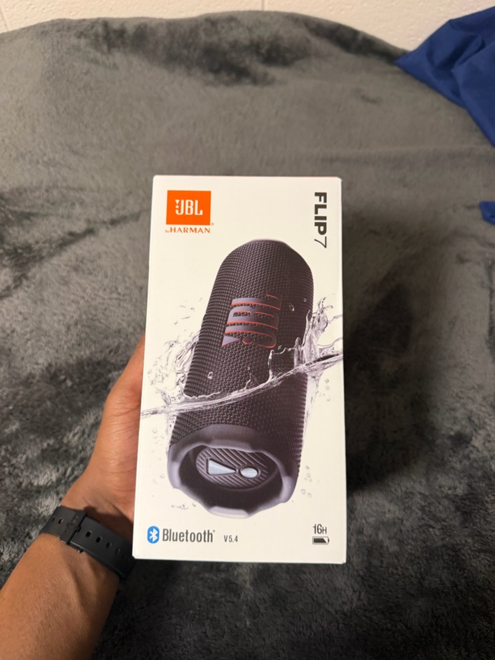 JBL Flip 7 Portable Bluetooth Speaker - Black with Orange Logo